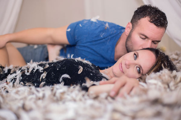 Snuggles and Smooches in the Pillow Fight: A fun and playful Couples Boudoir Photoshoot
